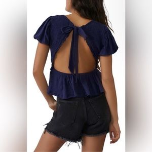 Free People Charlotte Navy blue Open Tie Back
Smocked top Size XL NEW